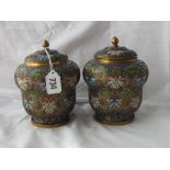 Pair of good quality cloisonné jars and covers with cut out decoration 7” high