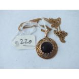 9ct mounted brown stone pendant on 9ct neck chain, 5.9g