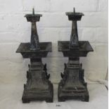 Good heavy pair of Chinese bronze pricket candle sticks of catering form and decorated with masks