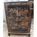 Decorative Chinese lacquered cabinet with folding doors 40” wide