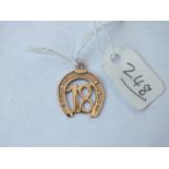 9ct charm in form of horse shoe and 18