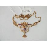 An attractive pearl and amethyst necklace set in 15ct gold