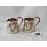 Pair of continental small jugs (800 std) applied with scroll cartouche 2.5” high