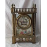 Decorative brass mounted clock with porcelain plaque