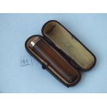 9ct and amber mounted cigarette holder in fitted case