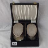 Pair of boxed plain hair brushes and a comb