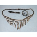 A gilt fringe necklace and 2 paste brooches