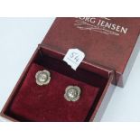 A pair of George Jensen silver ear studs with flower heads in original box