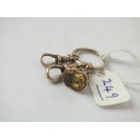 An antique gold mounted intaglio fob seal on gold split ring, plus dog clips