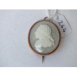 An unusual 19th Century gold mounted cameo of jet under glass