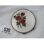 A compact, the hinged cover enamelled with red roses 2/3 “ Dia.