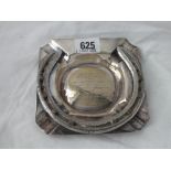 A plated horse shoe decorated ashtray 5” wide