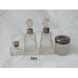 A pair of scent bottles with glass bodies and two other items