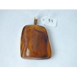 A large gold mounted amber pendant, 30.5g