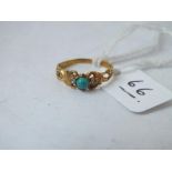 An antique turquoise and rose diamond child’s ring set in gold, size F