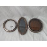 Two circular photo frames and oval example