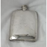 A plain hip flask of curved outline and bayonet cover – Sheffield 1945 by H.A, 226g