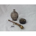 A brass Boson’s whistle, a white metal flask and a jar