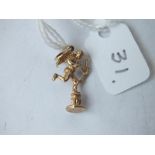 A 9ct cupid on pedestal charm