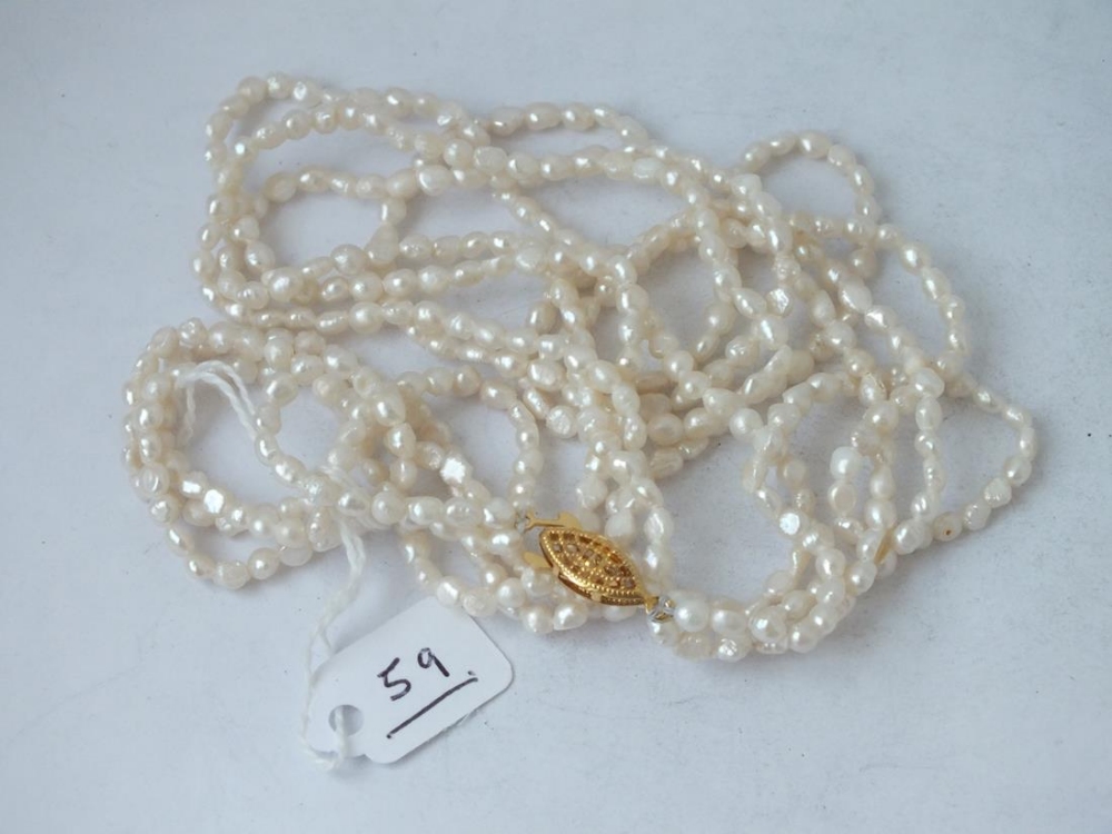 A triple row of river pearls