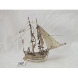 A small Dutch silver galleon with two masks, import marks, 5” high