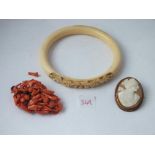 Oval cameo, a coral brooch and a bangle