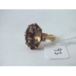 An oval brown stone dress ring with diamond shoulders set in 14ct, 6g, size K