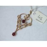 A pearl and garnet heart shaped pendant set in 9ct