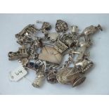 A good silver charm bracelet with stamp envelope etc., 111g