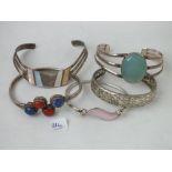 Five various silver bangles, some stone inset
