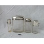 Four various silver top jars