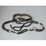 An unusual bead necklace and a link bracelet with cameo