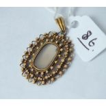 Antique gold filigree bordered pendant with moon stone query to centre 3.2g