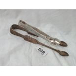 A pair of Irish sugar tongs Dublin by R.W and a pair of bright cut tongs