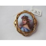 A pinchbeck mounted porcelain brooch of a Scottish lady