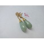 Pair of gold mounted jadeite ear pendants