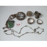 Four silver rings, a brooch etc