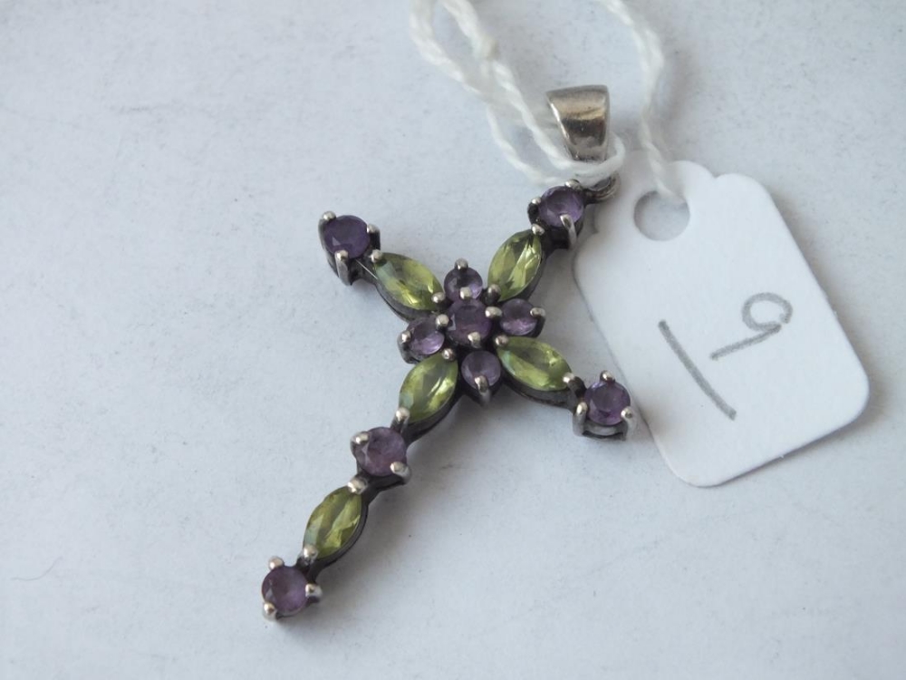 A peridot & amethyst cross