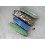 Three enamel decorated clothes brushes and another