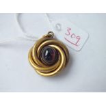 Gold coil pendant with cabochon garnet to centre – 6.5gms