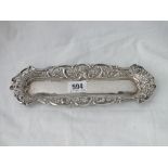 An embossed bordered pen tray 9 ½ “ long – Chester 1894