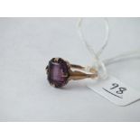 A purple stone dress ring set in 9ct, 1.9g,size M