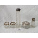 Five silver mounted jars etc.,