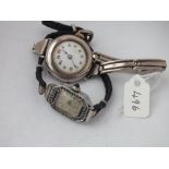 Ladies silver wrist watch on strap and another, also silver