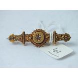 A Victorian 15ct gold brooch inset with a diamond