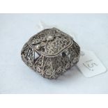 A small silver filigree box with hinged cover