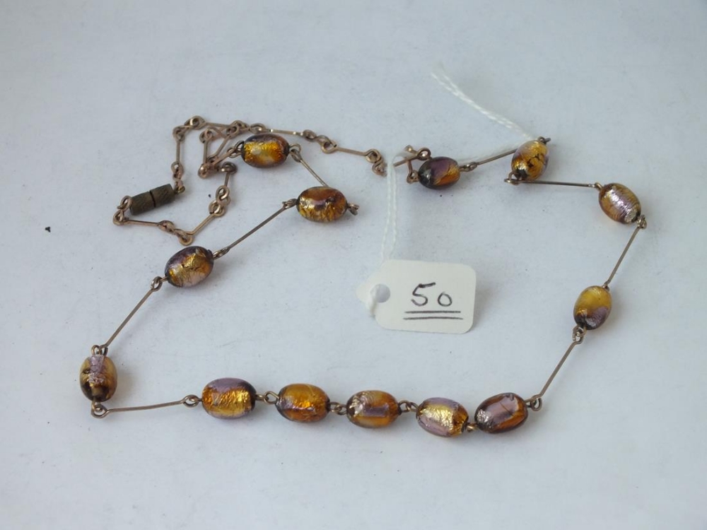 A foil glass bead necklace