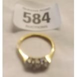 A THREE STONE DIAMOND RING SET IN 18CT & PLATINUM