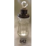 A SILVER MOUNTED SCENT BOTTLE & STOPPER - LONDON 1910. 4" LONG