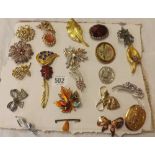 PAD OF COSTUME BROOCHES